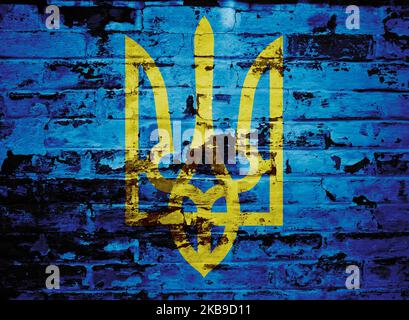 Coat of Arms of Ukraine painted on brick wall Stock Photo