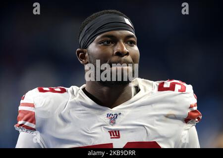 New York Giants linebacker Carter Coughlin (52) walks off the field after  an NFL football game against the Washington Commanders Sunday, Dec. 4,  2022, in East Rutherford, N.J. (AP Photo/Adam Hunger Stock