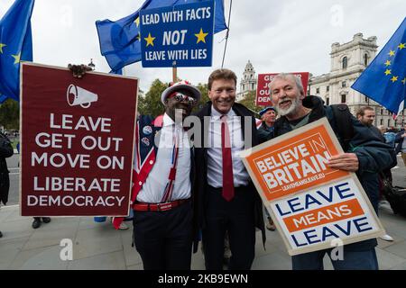 Brexit Party chairman Richard Tice MEP (C) poses with anti-EU demonstrators outside the Houses of Parliament on 28 October, 2019 in London, England. Today MPs debate and vote on a government's motion calling for a General Election to take place on 12 December 2019. The European Union granted a Brexit etension until 31 January 2020 with an option for the UK to leave earlier if a deal is ratified. (Photo by WIktor Szymanowicz/NurPhoto) Stock Photo