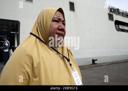 Hundreds of families of the victims of the Boeing 737 Max 8 Lion Air which was crash in Java Sea, descended the Indonesian Navy's LPD ship at Tanjung Priok harbour, Jakarta, after doing flowers and prayers at the crash site on Tuesday, October 29, 2019. The event was conduct by Lion Air management to marks one year of the disaster. (Photo by Aditya Irawan/NurPhoto) Stock Photo