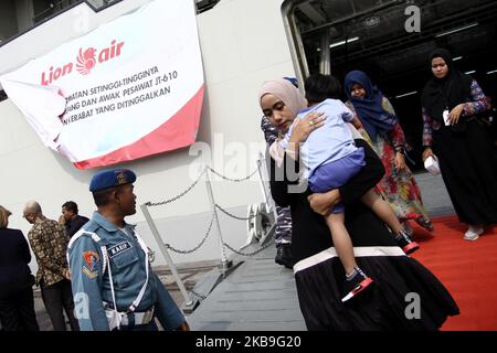 Hundreds of families of the victims of the Boeing 737 Max 8 Lion Air which was crash in Java Sea, descended the Indonesian Navy's LPD ship at Tanjung Priok harbour, Jakarta, after doing flowers and prayers at the crash site on Tuesday, October 29, 2019. The event was conduct by Lion Air management to marks one year of the disaster. (Photo by Aditya Irawan/NurPhoto) Stock Photo