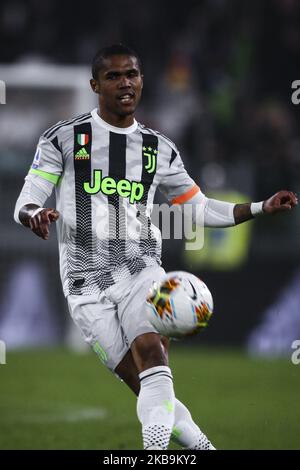 Juventus forward Douglas Costa (11) in action during the Serie A football match n.10 JUVENTUS - GENOA on October 30, 2019 at the Allianz Stadium in Turin, Piedmont, Italy. Final result: Juventus-Genoa 2-1. (Photo by Matteo Bottanelli/NurPhoto) Stock Photo