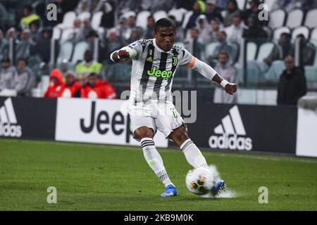 Juventus forward Douglas Costa (11) in action during the Serie A football match n.10 JUVENTUS - GENOA on October 30, 2019 at the Allianz Stadium in Turin, Piedmont, Italy. Final result: Juventus-Genoa 2-1. (Photo by Matteo Bottanelli/NurPhoto) Stock Photo