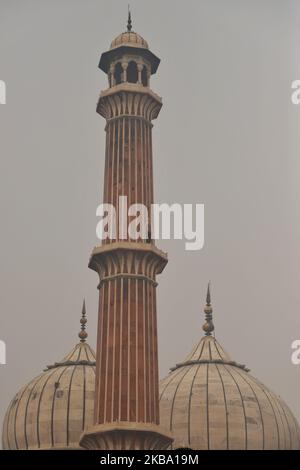 Minarets of Jama Masjid (Grand Mosque) are seen amid smog in the Old Quarters of Delhi India on 03 November 2019 (Photo by Nasir Kachroo/NurPhoto) Stock Photo