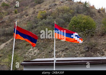 Armenian and Artsakh (Nagorno Karabach) flags displayed on a border of unrecognised Republic of Artsakh on October 9, 2019. The Republic is a subject of dispute between Azerbaijan and Armenians, it historically is occupied by Armenians but was included into Azerbaijan after the collapse of Soviet Union. Artsakh is today a de facto independent state but it is not recognised by any other party. It is possible to enter Artsakh only through Armenia. (Photo by Dominika Zarzycka/NurPhoto) Stock Photo