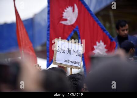 Students aligned with All Nepal National Free Students Union, sister wing of ruling Nepal Communist Party, stage a demonstration by holding Back Off India in Kathmandu, Nepal on Wednesday, November 06, 2019 against the controversial map released by India. India has released a new map showing Nepal’s land Kalapani and Lipulek as Indian territory. (Photo by Narayan Maharjan/NurPhoto) Stock Photo