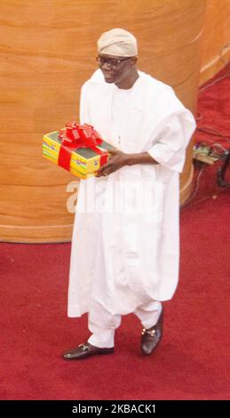 Lagos State Governor Babajide Sonwo-Olu carrying the estimated budget, at the 2020 budget presentation in Lagos, Nigeria November 8 2019. (Photo by Olukayode Jaiyeola/NurPhoto) Stock Photo