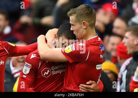 Ryan Yates (22) of Nottingham Forest kisses Lewis Grabban (7) of Nottingham Forest during the Sky Bet Championship match between Nottingham Forest and Derby County at the City Ground, Nottingham on Saturday 9th November 2019. (Credit: Jon Hobley | MI News) Stock Photo