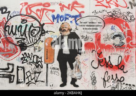 A graffiti of Karl Marx seen on a still-standing section of the former Berlin Wall called the East Side Gallery, of the Berlin Wall. On Saturday, November 9, 2019, in Berlin, Germany. (Photo by Artur Widak/NurPhoto) Stock Photo