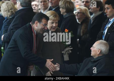 Ekrem ?mamo?lu (Left), a Turkish politician and current Mayor of Istanbul, is introduced by German Chancellor Angela Merkel (Center) to Wolfgang Schaeuble (Right), president of the Bundestag, as they arrive to attend the central commemoration ceremony for the 30th anniversary of the fall of the Berlin Wall, at the Berlin Wall Memorial at Bernauer Strasse in Berlin. On Saturday, November 9, 2019, in Berlin, Germany. (Photo by Artur Widak/NurPhoto) Stock Photo