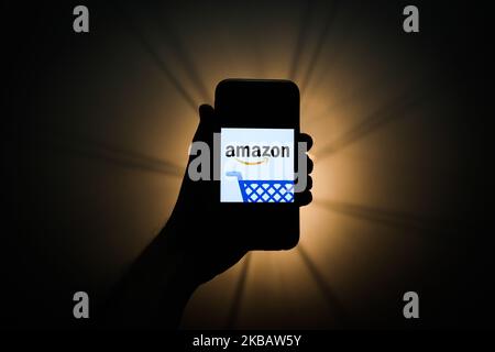 Amazon logo is seen displayed on a phone screen in this illustration photo taken in Krakow, Poland on November 13, 2019. (Photo by Jakub Porzycki/NurPhoto) Stock Photo
