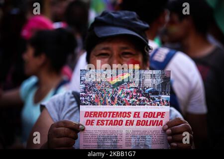 Bolivian residents in Argentina, social organizations and leftist activists protest in front of the Bolivian embassy in Buenos Aires against the coup in Bolivia, on November 15, 2019. (Photo by Carol Smiljan/NurPhoto) Stock Photo