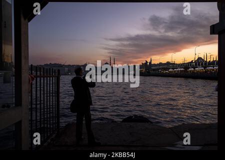 The sun goes down over Karakoy district of Istanbul on November 15, 2019. (Photo by Onur Dogman/NurPhoto) Stock Photo