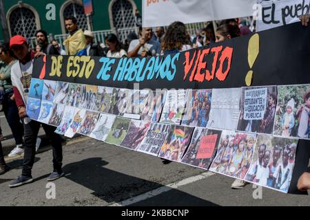 On November 21, the National Unemployment took place in Colombia, with replicas in all the cities and municipalities of the country. Thousands of people marched through the main avenues of Bogota to reach the Plaza de Bolivar, where after a peaceful day, hooded groups clashed against the Mobile Riot Squadron (ESMAD), ending in strong riots. Hours later, a Cacerolazo was held in protest in all the neighborhoods of the city, where families and neighbors gathered to express their lack of confidence with the current government of President Duque in Bogota, Colombia on November 21, 2019. (Photo by  Stock Photo