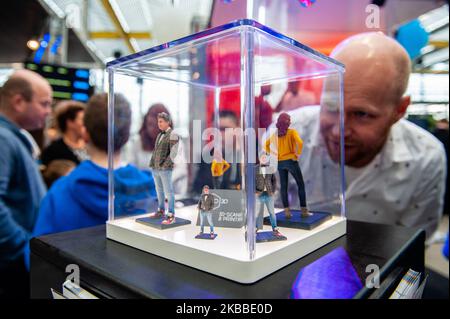 A man is looking a 3D mini people during the Bright Day Festival in Amsterdam, on November 23rd, 2019. (Photo by Romy Arroyo Fernandez/NurPhoto) Stock Photo