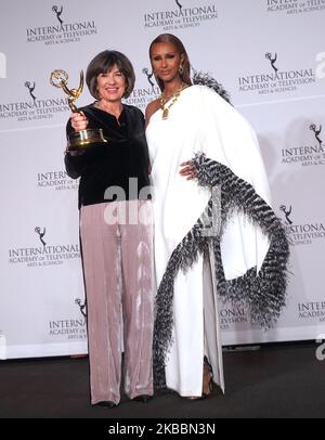 Iranian British journalist Christiane Amanpour (L) poses in the press room, alongside Somali-American fashion model Iman (R) at the 47th International Emmy awards night at New York Hilton on November 25, 2019 in New York City (Photo by Selcuk Acar/NurPhoto) Stock Photo