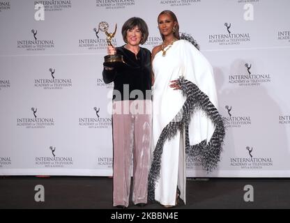 Iranian British journalist Christiane Amanpour (L) poses in the press room, alongside Somali-American fashion model Iman (R) at the 47th International Emmy awards night at New York Hilton on November 25, 2019 in New York City (Photo by Selcuk Acar/NurPhoto) Stock Photo