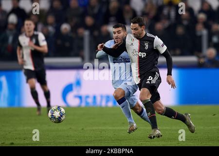 Mattia De Sciglio of Juventus and Angel Correa of Atletico Madrid competes for the ball during the UEFA Champions League group D match between Juventus and Atletico Madrid at Juventus Arena on November 26, 2019 in Turin, Italy. (Photo by Jose Breton/Pics Action/NurPhoto) Stock Photo