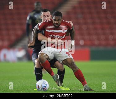 Middlesbrough's Britt Assombalonga battles with Barnsley's Cauley Woodrow during the Sky Bet Championship match between Barnsley and Middlesbrough at Oakwell, Barnsley on Wednesday 27th November 2019. (Photo by Mark Fletcher/MI News/NurPhoto) Stock Photo