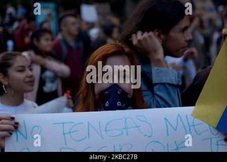 Colombian indigenous people and students protest against the government of Colombian President Ivan Duque on the occasion of the National Unemployment in Bogota, Colombia on December 1, 2019. (Photo by Vanessa Gonzalez/NurPhoto) Stock Photo