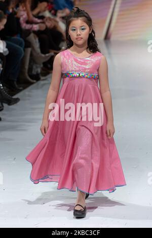 A model walks the runway at the Young Socialites collection for Spring and Summer 2020 during the third annual Toronto Kids Fashion Week fashion show on November 30, 2019 in Toronto, Canada (Photo by Anatoliy Cherkasov/NurPhoto) Stock Photo