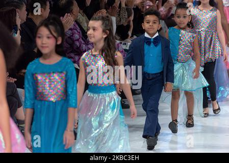 A model walks the runway at the Young Socialites collection for Spring and Summer 2020 during the third annual Toronto Kids Fashion Week fashion show on November 30, 2019 in Toronto, Canada (Photo by Anatoliy Cherkasov/NurPhoto) Stock Photo