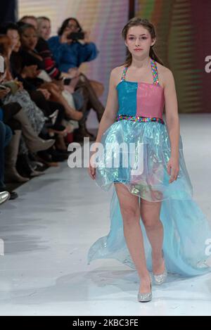 A model walks the runway at the Young Socialites collection for Spring and Summer 2020 during the third annual Toronto Kids Fashion Week fashion show on November 30, 2019 in Toronto, Canada (Photo by Anatoliy Cherkasov/NurPhoto) Stock Photo