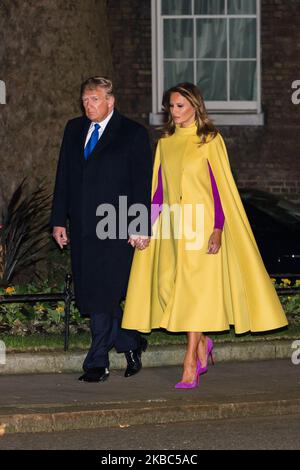 US President Donald Trump and First Lady Melania Trump walk in Downing Street to attend a reception for NATO leaders hosted by British Prime Minister Boris Johnson on 03 December, 2019 in London, England, ahead of the main summit tomorrow held to commemorate the 70th anniversary of NATO. (Photo by WIktor Szymanowicz/NurPhoto) Stock Photo