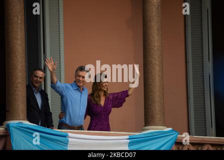 Argentina's President Mauricio Macri, center, his wife Juliana Awada and his running-mate Miguel Angel Pichetto stand on the balcony of the Casa Rosada executive mansion, during a rally in support of Macri, in Buenos Aires, Argentina, Saturday, Dec. 7, 2019 (Photo by Mario De Fina/NurPhoto) Stock Photo
