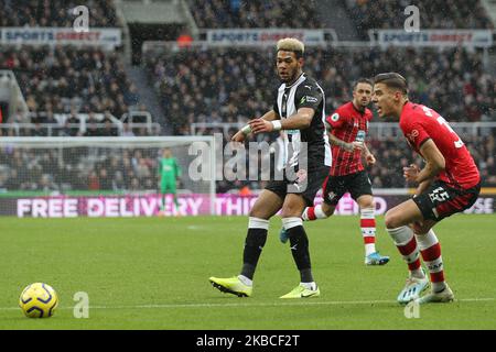 Joelinton of Newcastle United in action with Jan Bednarek of Southampton during the Premier League match between Newcastle United and Southampton at St. James's Park, Newcastle on Sunday 8th December 2019. (Photo by Mark Fletcher/MI News/NurPhoto) Stock Photo