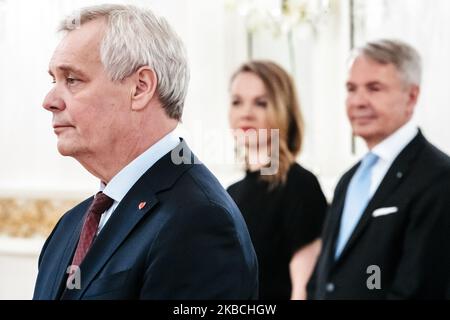 President Sauli Niinistö addresses resigned prime minister Antti Rinne as the resigned government of Finland pays a complimentary visit to the President of Finland at the Presidential Palace in Helsinki, Finland, on December 10, 2019. The leader of Centre Party Katri Kulmuni whose party forced the prime minister to resign is on the background. (Photo by Antti Yrjonen/NurPhoto) Stock Photo