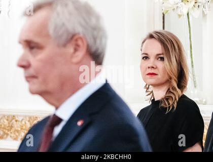 President Sauli Niinistö addresses resigned prime minister Antti Rinne as the resigned government of Finland pays a complimentary visit to the President of Finland at the Presidential Palace in Helsinki, Finland, on December 10, 2019. The leader of Centre Party Katri Kulmuni whose party forced the prime minister to resign is on the background. (Photo by Antti Yrjonen/NurPhoto) Stock Photo