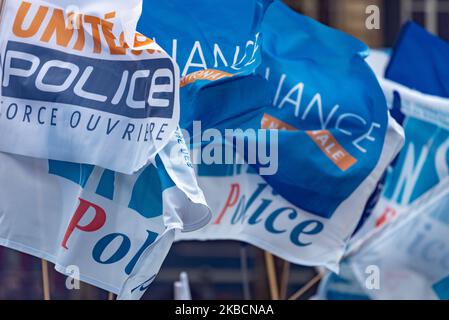 Illustrations of the flags of striking police officers' unions on Wednesday 11 December 2019, on the 7th day of the strike against pension reform and as Prime Minister Edouard Philippe announced the reform project before the EESC (Economic, Social and Environmental Council) in Paris, a few hundred striking police officers protested against the reform project and the end of their benefits by whistling the Prime Minister's arrival. This rally was initiated by the main police unions: Alliance Police Nationale, SGP Police FO and UNSA Police. (Photo by Samuel Boivin/NurPhoto) Stock Photo