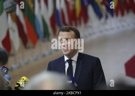 Emmanuel Macron President of the Republic of France arriving on the red carpet with the European flags in the background, having a doorstep press media statement at the European Council - Euro Summit - EU leaders meeting in Belgium, Brussels on December 12, 2019 (Photo by Nicolas Economou/NurPhoto) Stock Photo