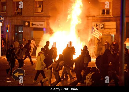 Protesters stand around a burning barricade during the 'El Clasico' Spanish League football match between Barcelona FC and Real Madrid CF in Barcelona on December 18, 2019.(Photo by Juan Carlos Lucas/NurPhoto) Stock Photo