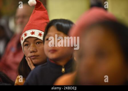 Nepalese Christian Kids attend on Holy Mass of worshipers singing Carol on Christmas Eve at Catholic Assumption Church in Dhobighat, Lalitpur, Nepal on Monday, December 24, 2019. (Photo by Narayan Maharjan/NurPhoto) Stock Photo