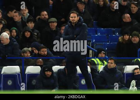 Chelsea's head coach Frank Lampard gives his autograph to fans after a ...