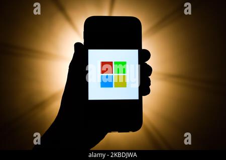 Microsoft logo is seen displayed on a phone screen in this illustration photo taken in Krakow, Poland on December 27, 2019. (Photo by Jakub Porzycki/NurPhoto) Stock Photo