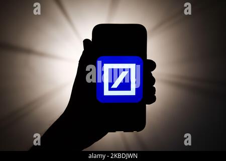 Deutsche Bank logo is seen displayed on a phone screen in this illustration photo taken in Krakow, Poland on December 26, 2019. (Photo by Jakub Porzycki/NurPhoto) Stock Photo