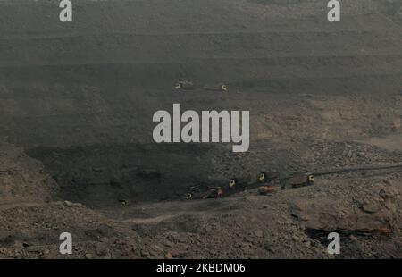 Smokes are seen inside the Coal mines due to endless fire just outskirts of the Dhanbad in Jharkhand state of India on 30 December 2019. (Photo by STR/NurPhoto) Stock Photo