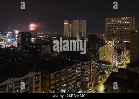 Fireworks explode around downtown area during New Year's Eve celebrations in Yangon, Myanmar on 01 January, 2020. (Photo by Shwe Paw Mya Tin/NurPhoto) Stock Photo