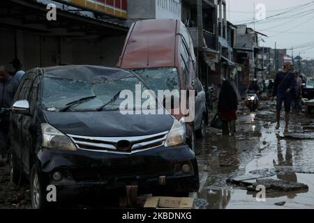 Situation after floods hit settlements in Bekasi city, West Java Province, outskirt of Capital Jakarta on Thursday, January 2nd, 2020, leaving mud, debris and demaged houses and vehicles. (Photo by Aditya Irawan/NurPhoto) Stock Photo