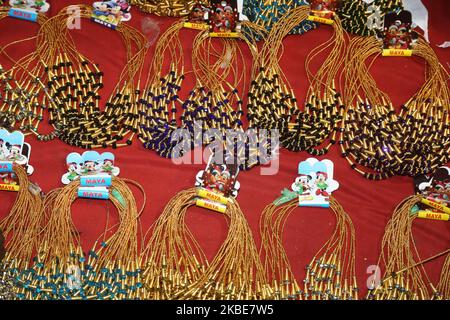 Necklaces displayed at a roadside shop on the night of the ninth day of the 10 day-long Attukal Pongala Mahotsavam Festival in the city of Thiruvananthapuram (Trivandrum), Kerala, India, on February 18, 2019. The Attukal Pongala Mahotsavam Festival is celebrated by millions Hindu women each year. (Photo by Creative Touch Imaging Ltd./NurPhoto) Stock Photo