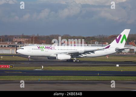 Wamos Air Airbus A330-200 commercial aircraft as seen on rotation phase, takeoff and flying from Brussels Zaventem National Airport BRU EBBR in the Belgian capital on 19 November 2019. The wide body long haul airplane has the registration EC-LNH and 2x RR Rolls Royce jet engines. Wamosair, Spanish carrier has the code EB, PLM, PULLMAN is an airline carrier, the former Pullmantur Air, with headquarters in Madrid, operating scheduled and leisure charter flights for holiday destinations in the Carribean like Varadero in Cuba, Punta Cana in the Dominican Republic, Cancun in Mexico etc . Brussels,  Stock Photo