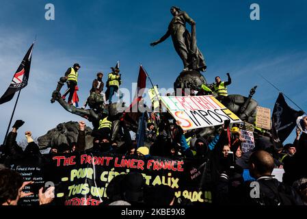 Demonstrators, mainly Gilets Jaunes, climbed the statue of the Nation on Saturday, January 11, 2020, on the 36th day of the strike against the pension reform. The intersyndicale organizations composed of CGT, FO, Solidaires, SUD, FSU and student organizations called for a new day of demonstration in Paris to demand the withdrawal of the pension reform project. The demonstration was quickly disrupted by clashes between demonstrators and police forces who responded with tear gas to disperse the hostile crowd. (Photo by Samuel Boivin/NurPhoto) Stock Photo