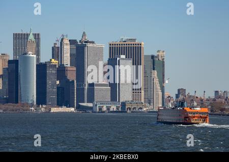 Iconic popular orange Staten Island Ferry in New York City connecting the Harbor of Lower ManhattanThe passenger ferry route is operated by NYC Department of Transportation, the historic route exists since 1817, carrying in 2019 25,2 million passengers. Nowadays 8 different boats operate from 4 classes - Kennedy, Barberi, Austen and Molinari, carrying locals and tourists offering view of Statue of Liberty, the skyscrapers and NY skyline, New York, USA - November 14, 2019 (Photo by Nicolas Economou/NurPhoto) Stock Photo