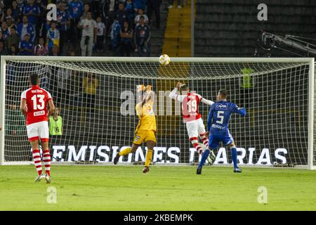 Millonarios goalkeeper, Wuilker Farinez defends the ball of Diego Valdes attack of Independiente Santa Fe during ESPN 2020 Tournament soccer match between Millonarios and Independiente Santa Fe on 15 January 2020 at 'El Campin' Stadium in Bogota, Colombia. (Photo by Daniel Garzon Herazo/NurPhoto) Stock Photo