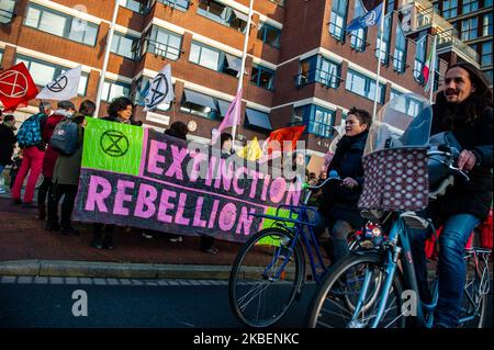XR activists are holding banners and shouting slogans in front of the Australian embassy during the second Extinction Rebellion solidarity demonstration with Australia, in The Hague, on January 16th, 2020. (Photo by Romy Arroyo Fernandez/NurPhoto) Stock Photo