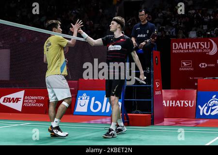 Anders Antonsen (R) of Denmark competes in the Men Singles semi-final match against Lee Cheuk Yiu of Hong Kong on day five of the Daihatsu Indonesia Master at Istora Gelora Bung Karno on January 18, 2020, in Jakarta, Indonesia. (Photo by Andrew Gal/NurPhoto) Stock Photo