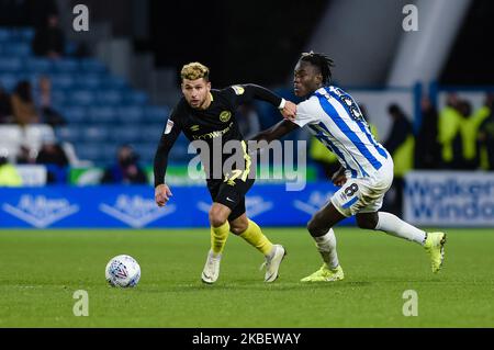 Brentford FC midfielder Emiliano Marcondes and Huddersfield Town midfielder Trevoh Chalobah during the Sky Bet Championship match between Huddersfield Town and Brentford at the John Smith's Stadium, Huddersfield on Saturday 18th January 2020. (Photo by Andy Whitehead/MI News/NurPhoto) Stock Photo